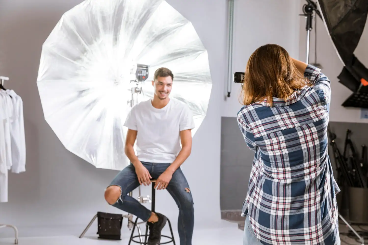 Front Lighting Photography Image of a man and woman getting photographed in a studio - Front Lighting Photography: How to Shoot With Front Light - Vorlane - Vorlane